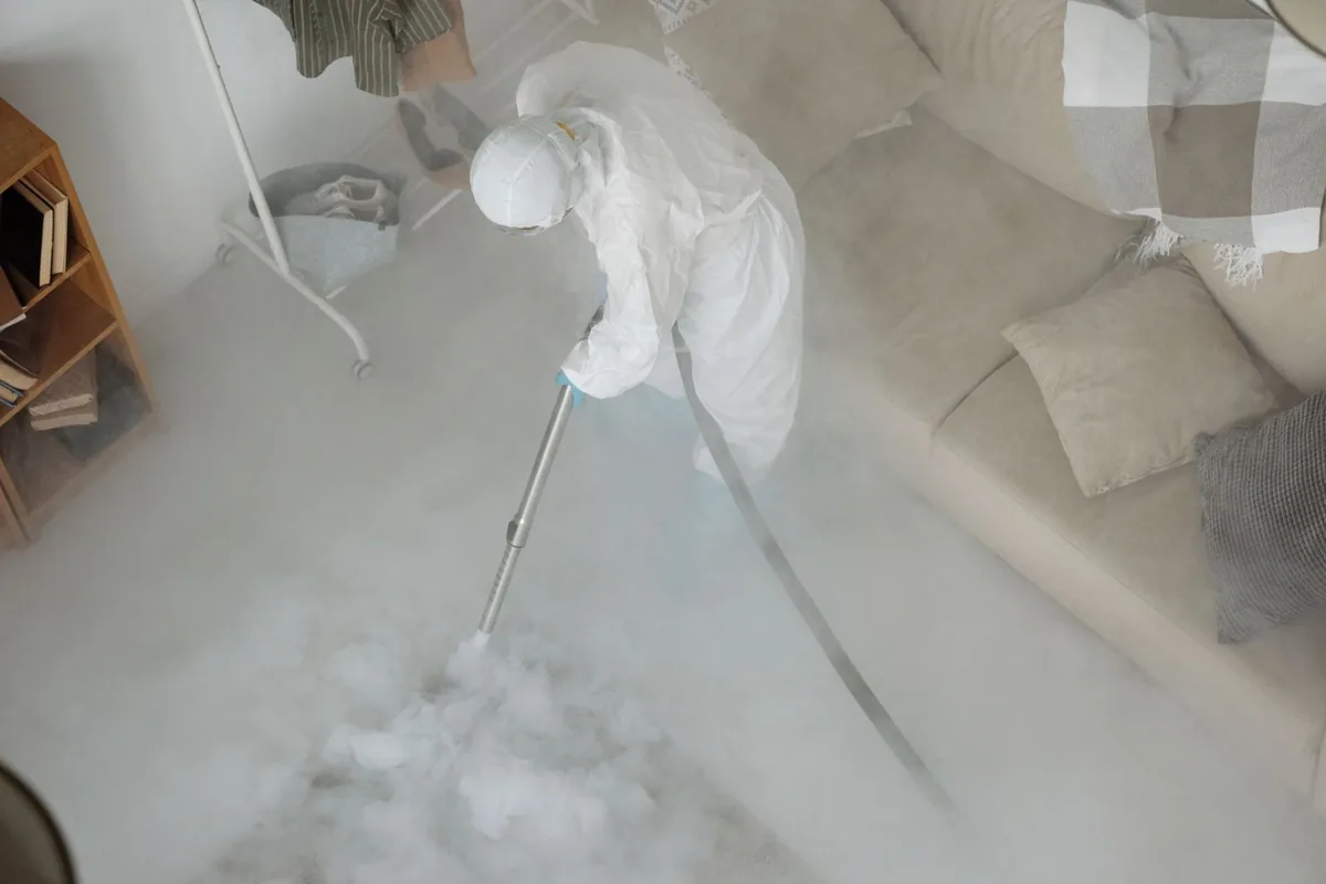 Biohazard cleanup technician in protective equipment, Sanborn, IA